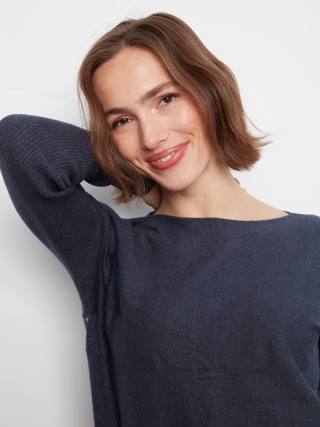Long Sleeve Boat Neck Sweater With Pockets And Eyelets Detail At Back